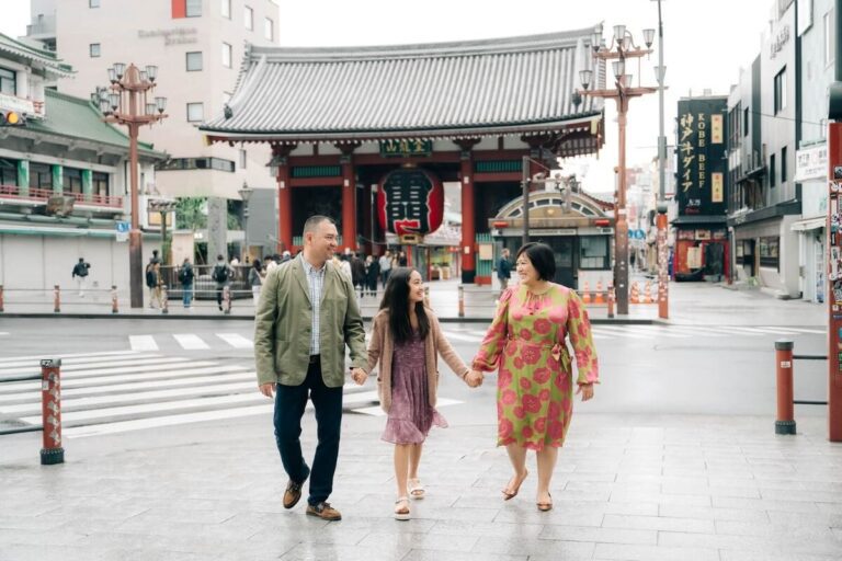 Family enjoying a stroll together near the iconic Senso-ji Temple in Asakusa, Tokyo, capturing a moment of connection and joy.