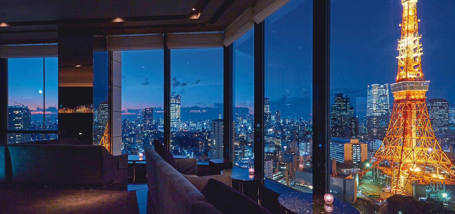 Luxurious Tokyo skyline view featuring the Eiffel-inspired Tokyo Tower illuminated at night, ideal for romantic gatherings.