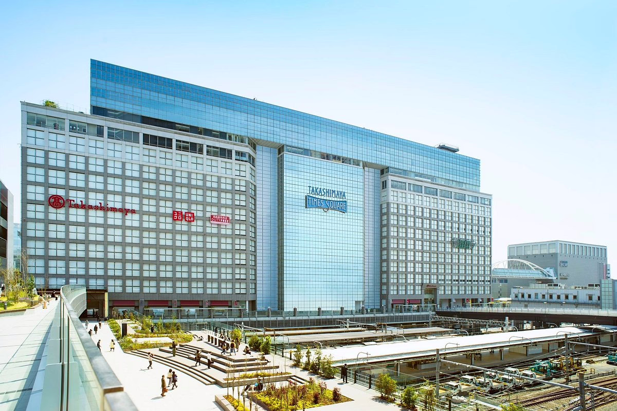 Modern Takashimaya Times Square building in Shinjuku, featuring shopping options and outdoor spaces for visitors to enjoy.