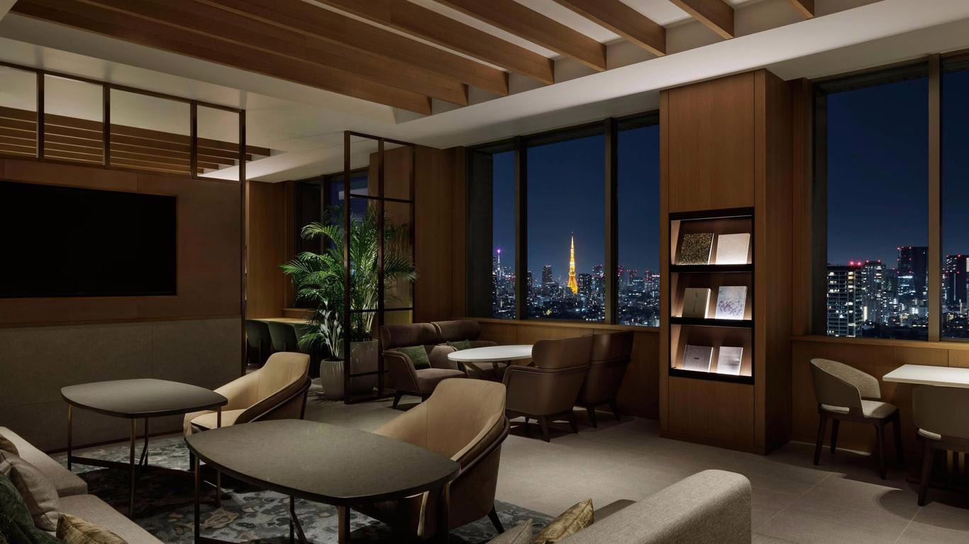 Sleek modern lounge with city skyline views, perfect for relaxing or socializing in an upscale urban atmosphere.