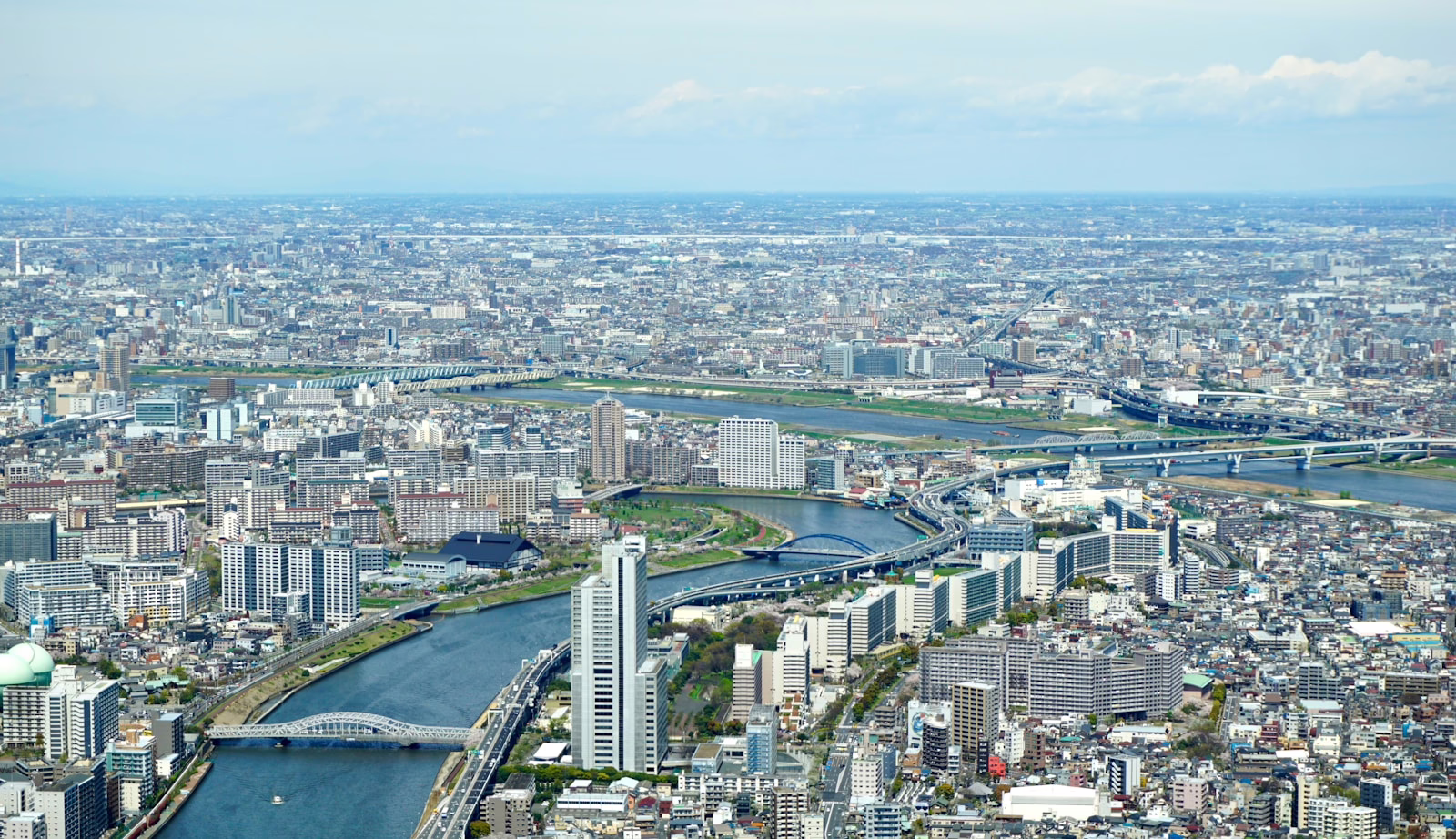 an aerial view of a city with a river running through it